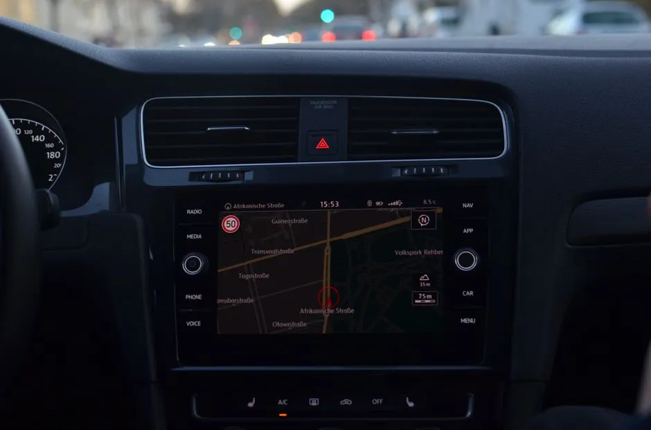 A car dashboard navigation display showing a street-level map